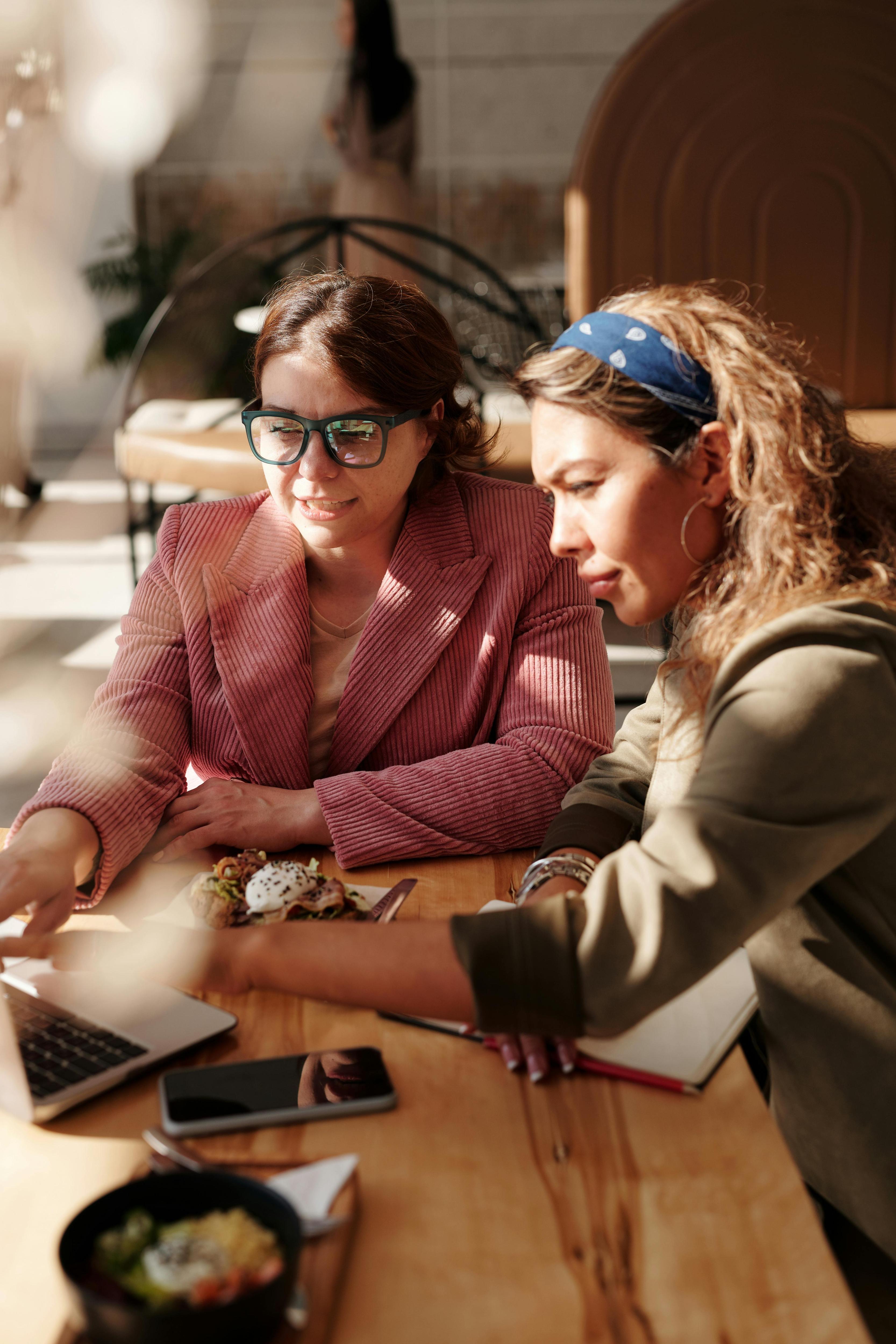 image of business-women sitting in conversation